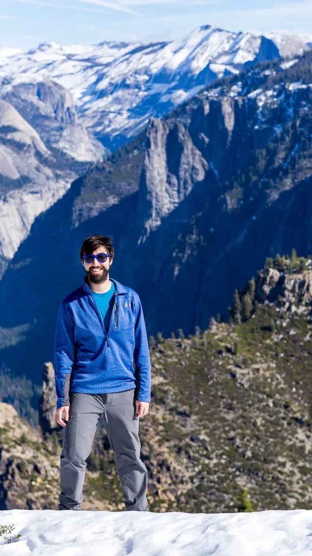Jay Honnold standing on a snowy overlook